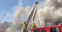 Crews gain control of downtown L.A. structure blaze that sent huge plume of smoke into the sky